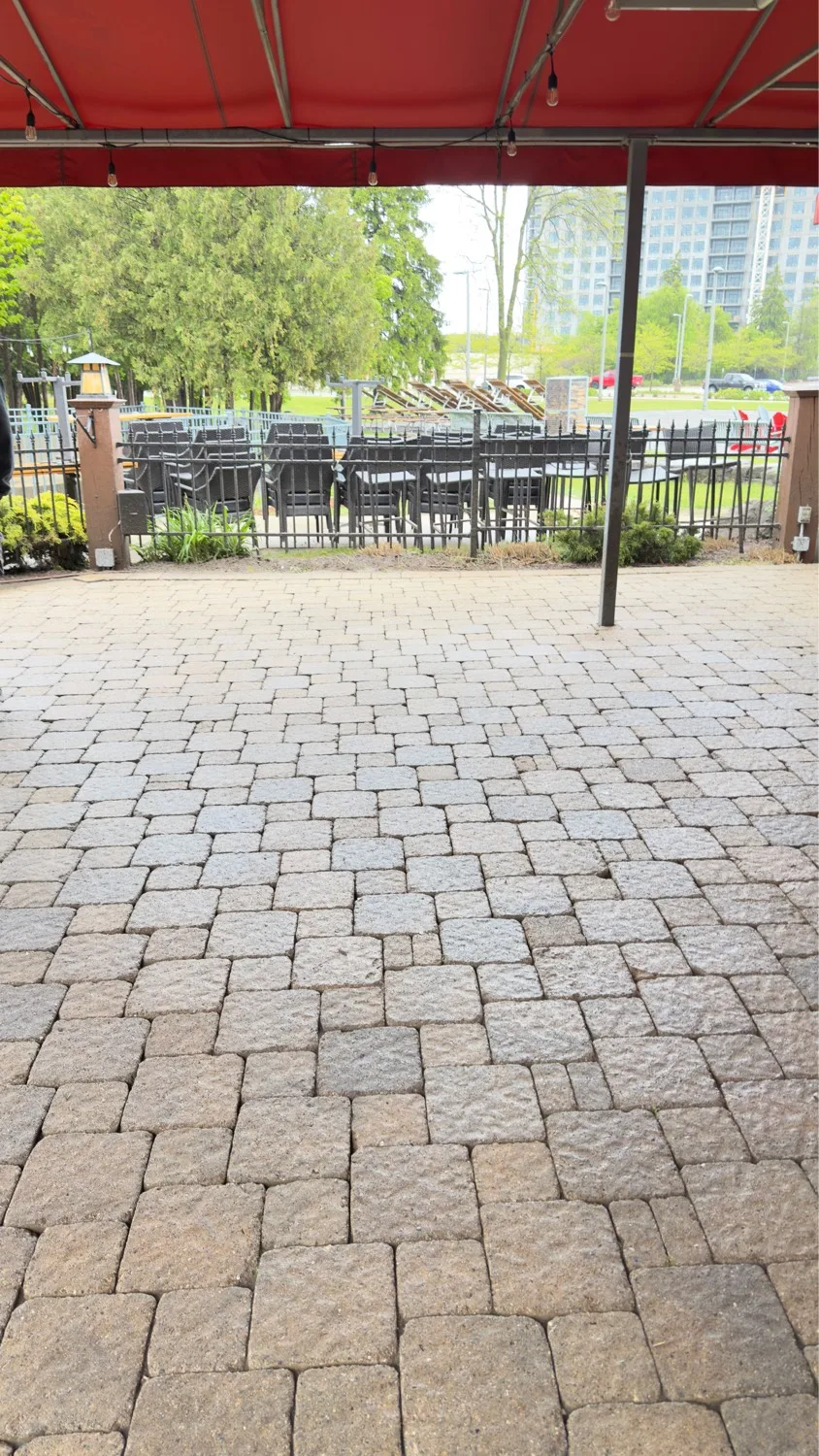 Commercial restaurant patio with freshly pressure-washed interlock pavers — D&D Home Services Kitchener